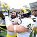 Michigan offensive linesman Elliott Mealer and linebacker Jake Ryan hold up the Little Brown Jug as they celebrate beating Minnesota 35-13 at TCF Bank Stadium in Minneapolis, Minn. on Saturday. Melanie Maxwell I AnnArbor.com